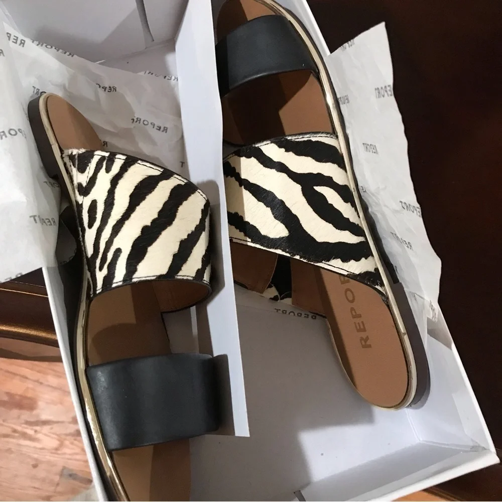 🦓REPORT Black Exotic Slip On Sandals